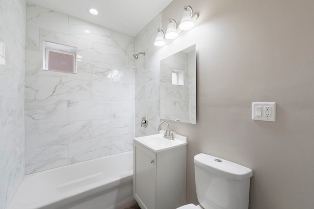 full bath featuring toilet, vanity, and bathing tub / shower combination