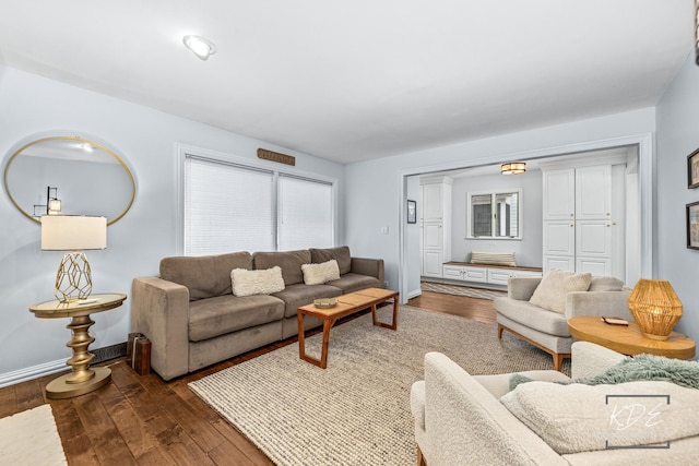 living room with hardwood / wood-style floors and baseboards