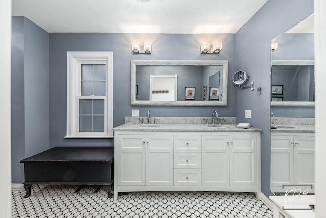 bathroom featuring double vanity and a sink