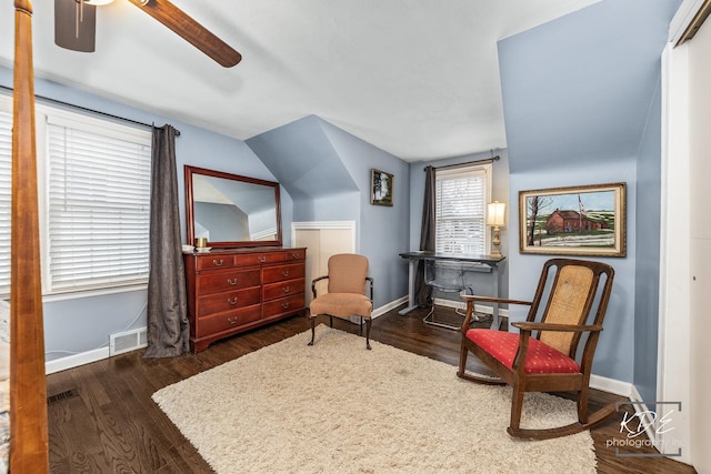 sitting room with ceiling fan, wood finished floors, visible vents, and baseboards