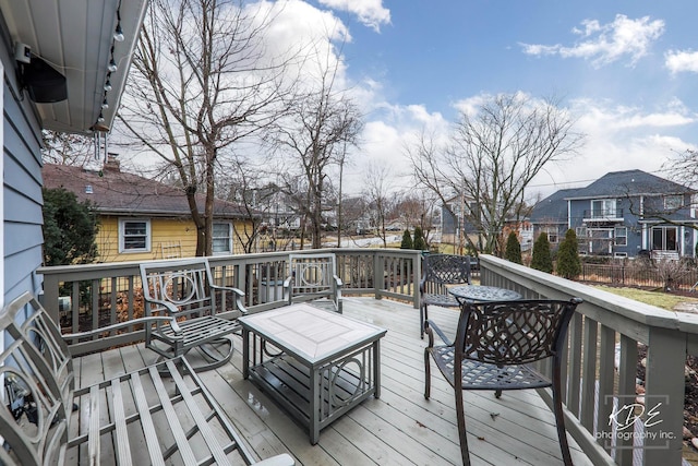 wooden deck featuring a residential view