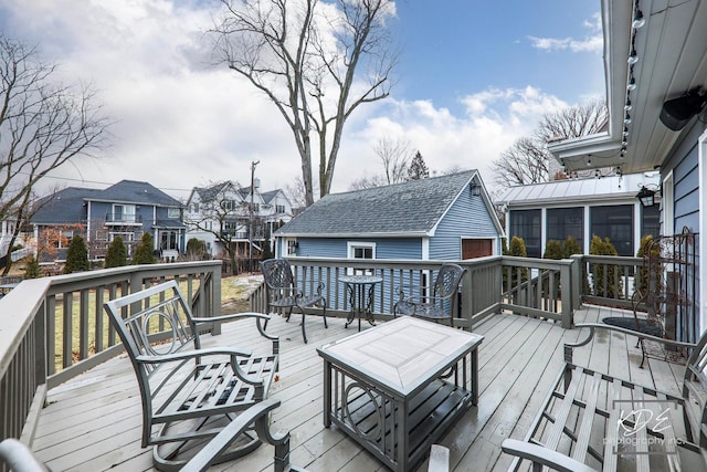 deck featuring a residential view and a sunroom