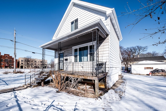 shotgun-style home featuring covered porch