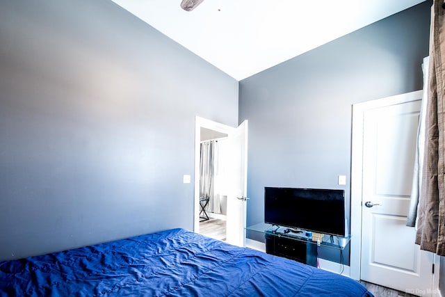 bedroom featuring vaulted ceiling and wood finished floors