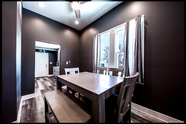 dining area featuring ceiling fan, baseboards, and wood finished floors