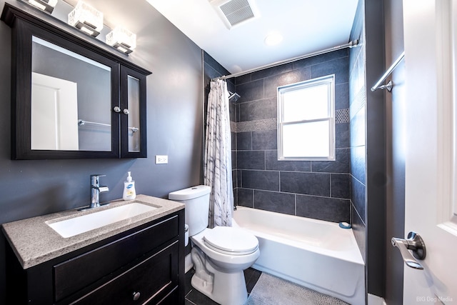 full bathroom with toilet, shower / tub combo, vanity, and visible vents