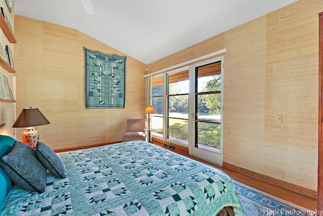 bedroom with a ceiling fan, visible vents, vaulted ceiling, and baseboards