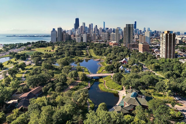 bird's eye view featuring a view of city and a water view