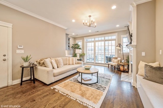 living area featuring a notable chandelier, dark wood-style floors, and recessed lighting