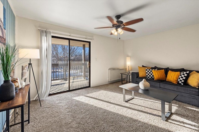 living room featuring carpet floors and ceiling fan