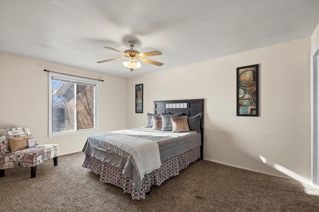 bedroom featuring dark carpet and ceiling fan