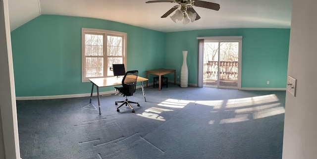 home office featuring lofted ceiling, carpet, baseboards, and a ceiling fan