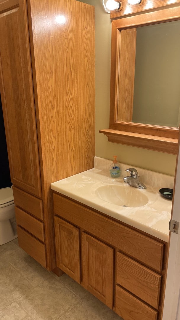 half bath with vanity and toilet