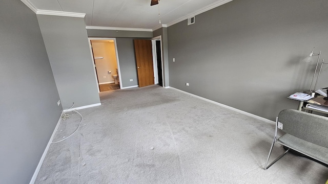 unfurnished bedroom featuring crown molding, carpet floors, visible vents, and baseboards