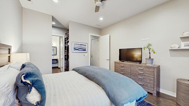 bedroom featuring ceiling fan, connected bathroom, recessed lighting, dark wood-style flooring, and baseboards