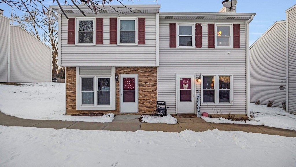 view of front of home featuring brick siding