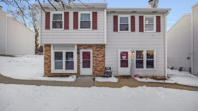 view of front of home featuring brick siding