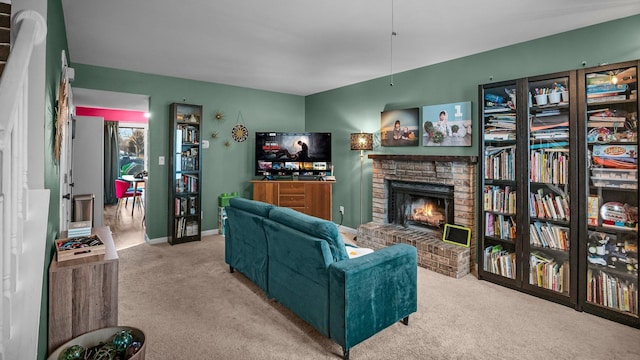 living room featuring carpet flooring, a fireplace, and baseboards