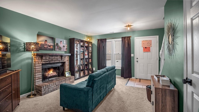 living room with a brick fireplace, carpet flooring, and baseboards