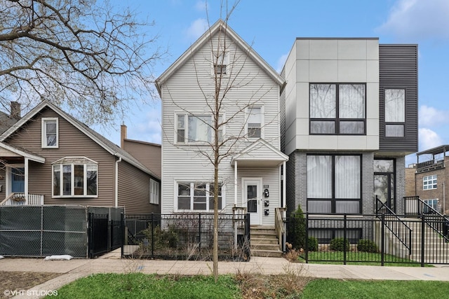2531 W Lyndale St, Chicago, IL 60647 - view of front of property with a gate and a fenced front yard