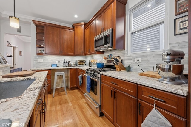 2531 W Lyndale St, Chicago, IL 60647 - kitchen featuring appliances with stainless steel finishes, ornamental molding, open shelves, light wood-type flooring, and decorative backsplash