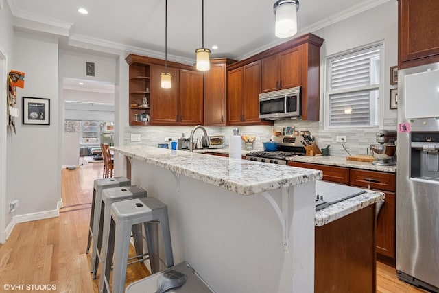2531 W Lyndale St, Chicago, IL 60647 - kitchen featuring appliances with stainless steel finishes, open shelves, a kitchen bar, tasteful backsplash, and ornamental molding