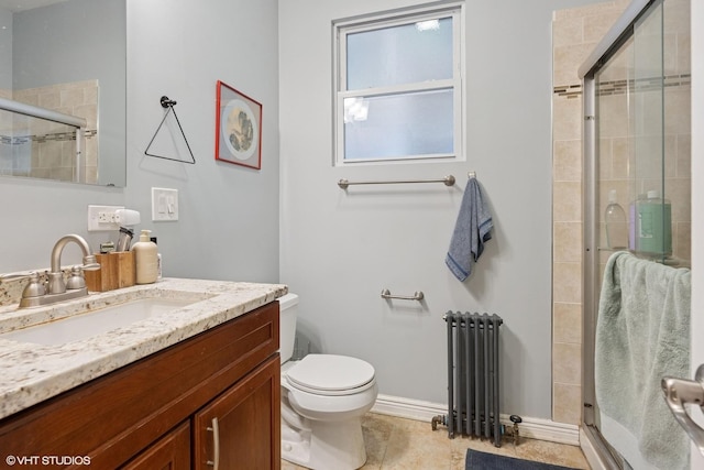 2531 W Lyndale St, Chicago, IL 60647 - bathroom featuring radiator, vanity, a stall shower, and tile patterned floors
