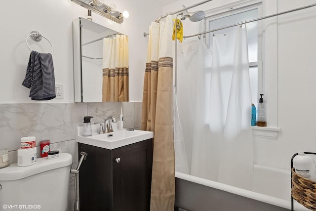 2531 W Lyndale St, Chicago, IL 60647 - bathroom featuring vanity, shower / bath combo, tile walls, and tasteful backsplash