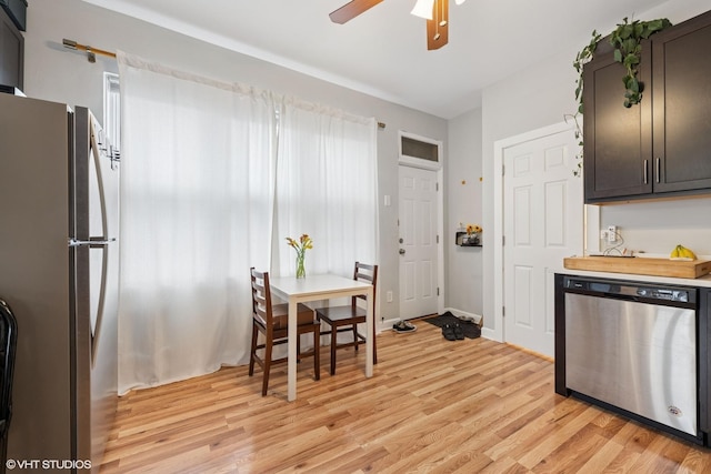 2531 W Lyndale St, Chicago, IL 60647 - kitchen with dishwasher, freestanding refrigerator, light wood finished floors, a ceiling fan, and light countertops