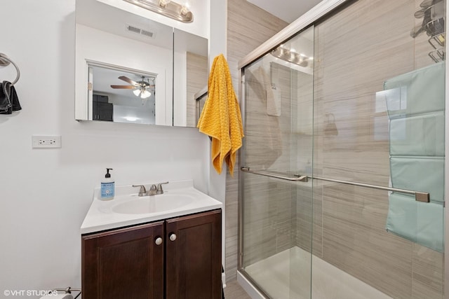 2531 W Lyndale St, Chicago, IL 60647 - full bathroom featuring vanity, ceiling fan, and a shower stall