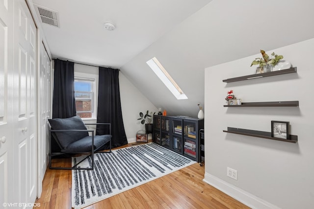 2531 W Lyndale St, Chicago, IL 60647 - sitting room with a skylight, wood finished floors, and vaulted ceiling