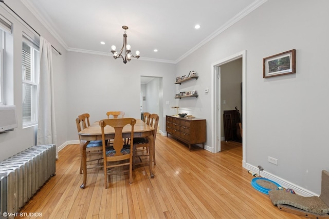 2531 W Lyndale St, Chicago, IL 60647 - dining room featuring radiator, a chandelier, light wood-style floors, recessed lighting, and crown molding