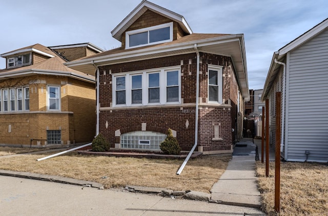 view of front of house with brick siding