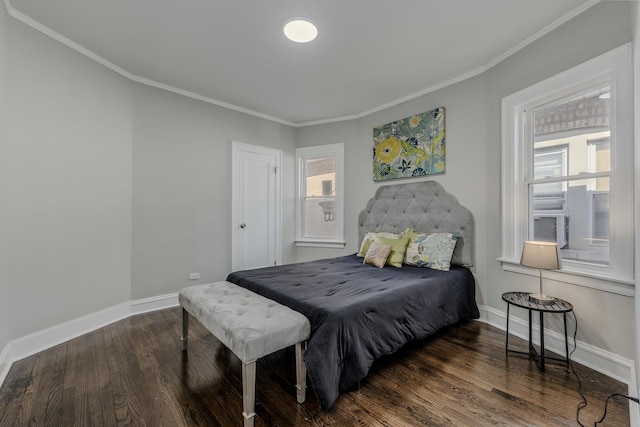 bedroom featuring cooling unit, crown molding, baseboards, and wood finished floors