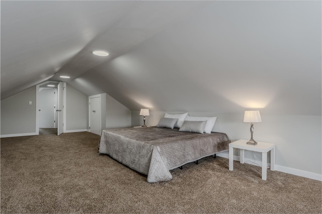 bedroom with carpet, lofted ceiling, and baseboards