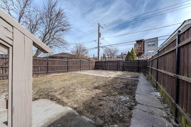 view of yard with a fenced backyard