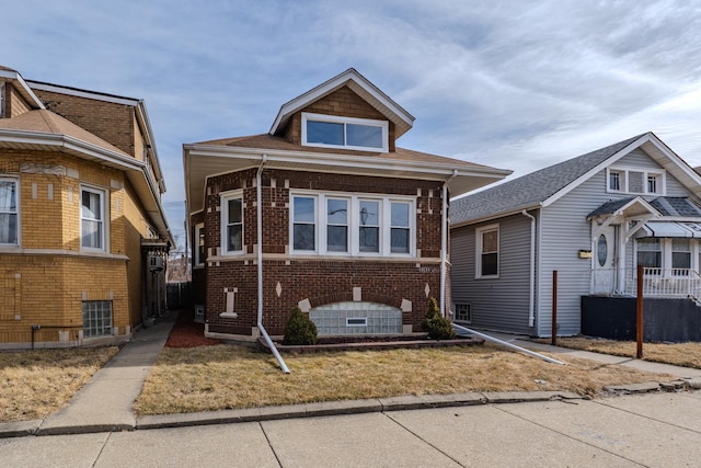 bungalow-style home with brick siding