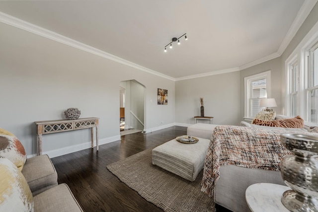 bedroom featuring arched walkways, wood-type flooring, baseboards, and crown molding