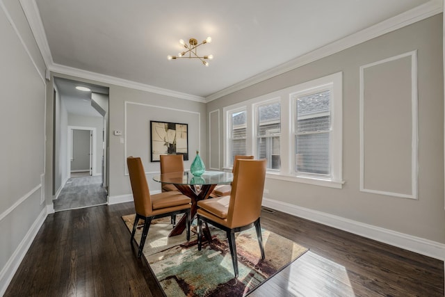 dining space with a chandelier, dark wood-style flooring, crown molding, and baseboards