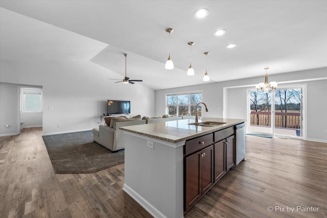 kitchen with open floor plan, dark wood-style floors, and a wealth of natural light