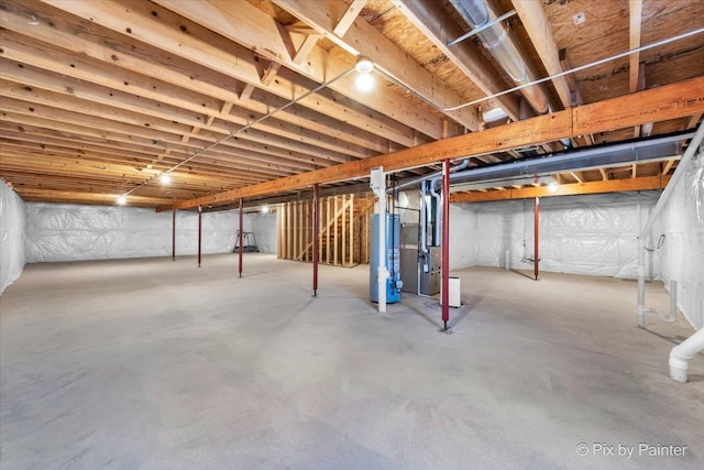 unfinished basement featuring heating unit and water heater