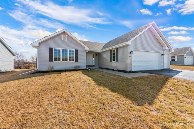 single story home with a front yard, driveway, and an attached garage