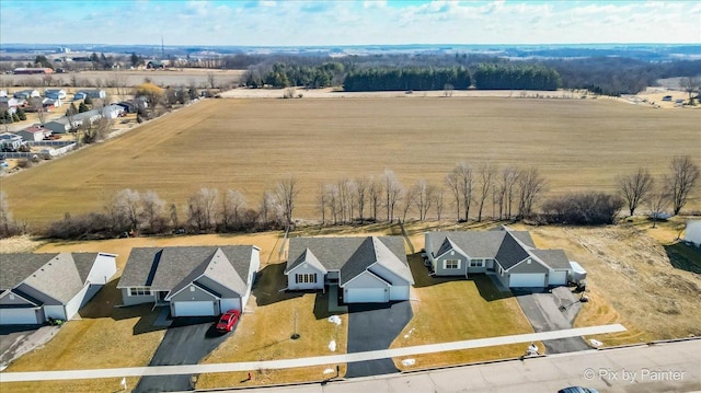 drone / aerial view with a residential view and a rural view