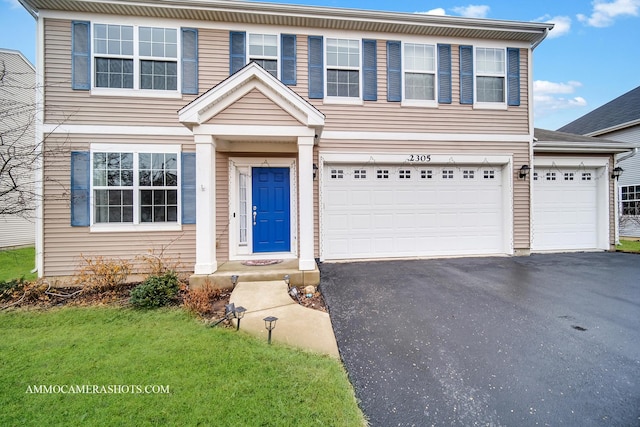 view of front of property with aphalt driveway