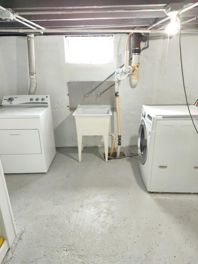 clothes washing area featuring laundry area and independent washer and dryer