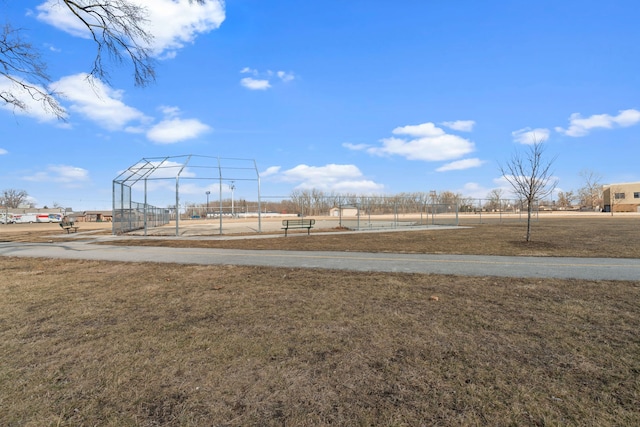 exterior space featuring fence and a lawn