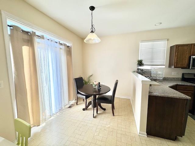 dining space with baseboards