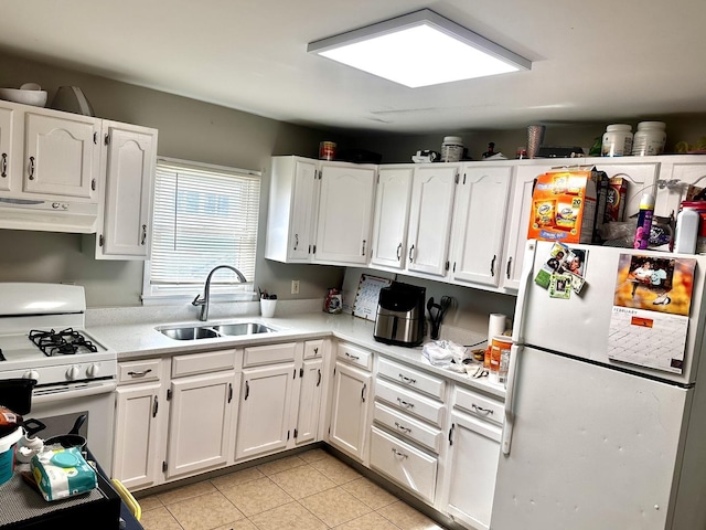 kitchen with under cabinet range hood, white appliances, a sink, white cabinetry, and light countertops