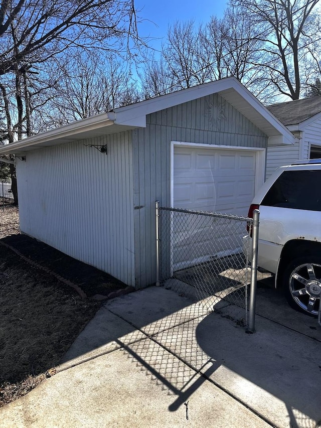 detached garage with concrete driveway