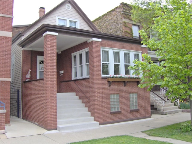 view of front of home with brick siding